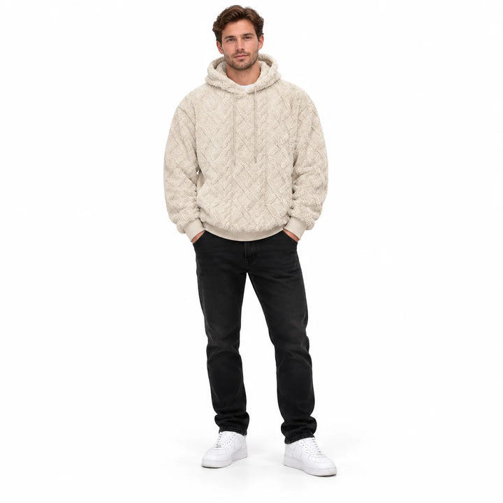 Khaki-cream pullover shown from the front on a full-length male model with textured geometric pattern and matching hood ties.