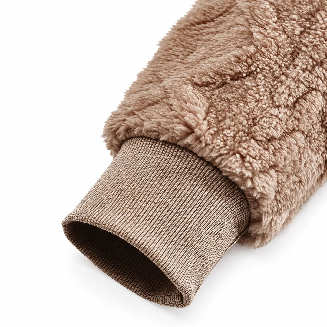 Close-up of a camel brown sleeve and matching ribbed cuff on a white background, showing the plush texture and open rib cuff.