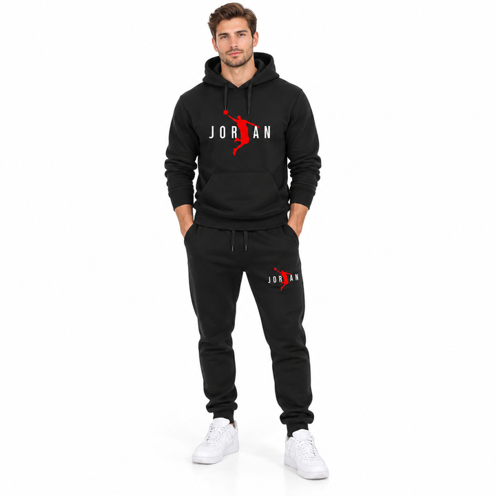 Male model wearing the black / white lettering hoodie and black pants set on a white studio background.
