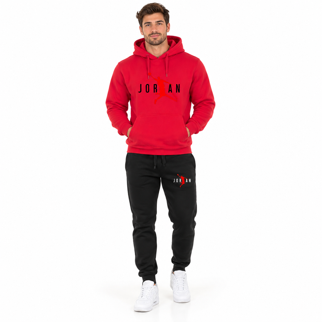Male model wearing the red / black lettering hoodie and black pants set on a white studio background.