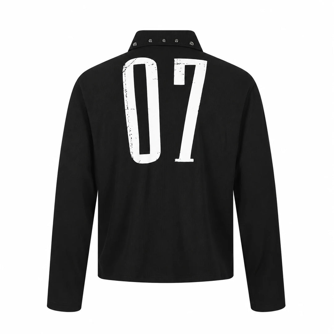 Back view of this black long sleeve unisex polo with a large distressed white 07 print, silver collar studs and straight hem.