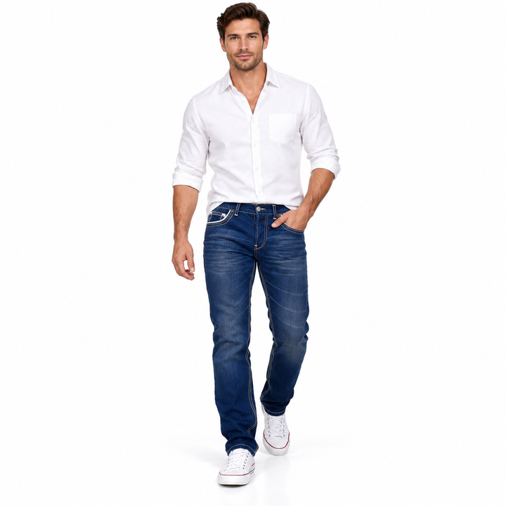 Dark Blue jeans styled with a white shirt on a walking male model