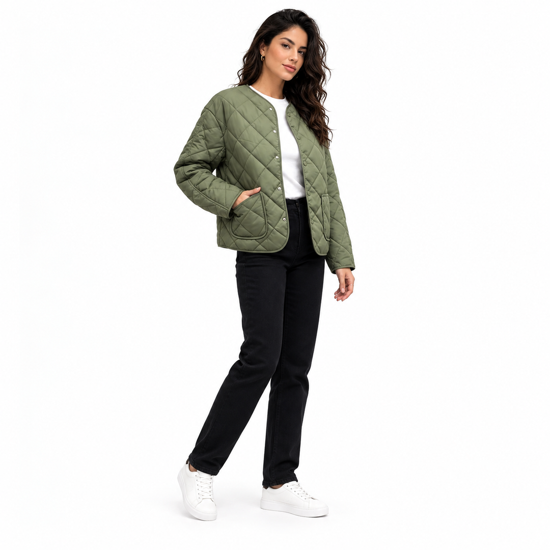 Green quilted jacket in a three-quarter side view on a full-body female model