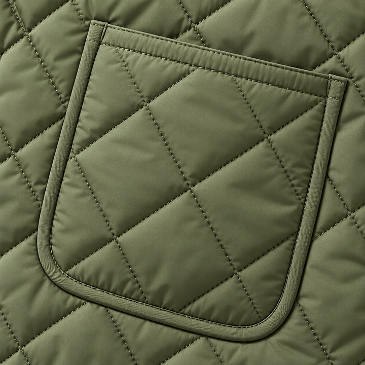Close-up of the Green quilted jacket patch pocket and diamond stitching