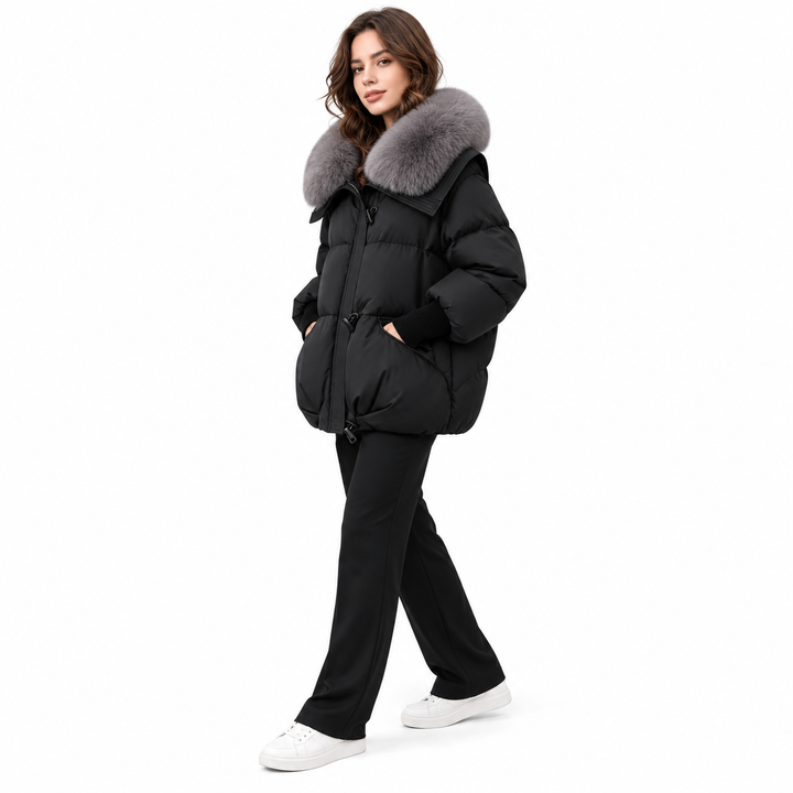 Black puffer jacket with grey faux fur collar in a full-body side view