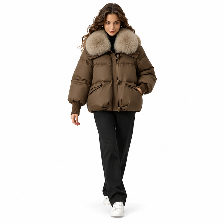 Coffee puffer jacket styled with dark trousers and sneakers on a walking model