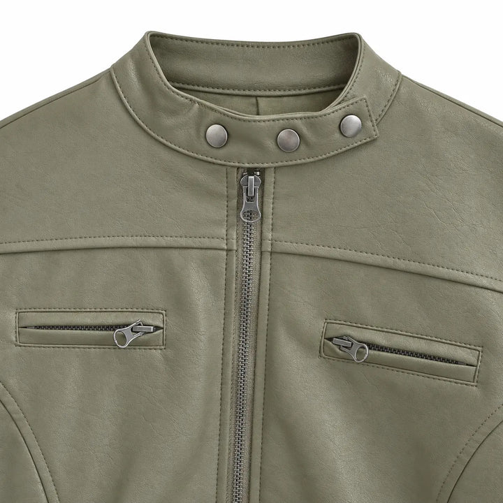 Gray Green stand collar detail showing three silver studs, with the front zipper, chest zips and shoulder stitching on white.