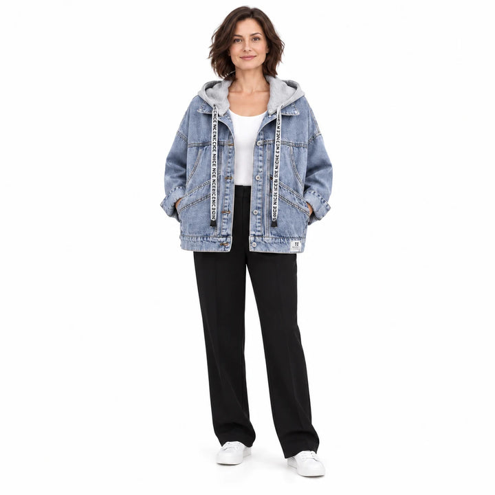 Second adult model wearing the washed blue jacket with grey hood, curved pockets and long sleeves, in a full body studio view