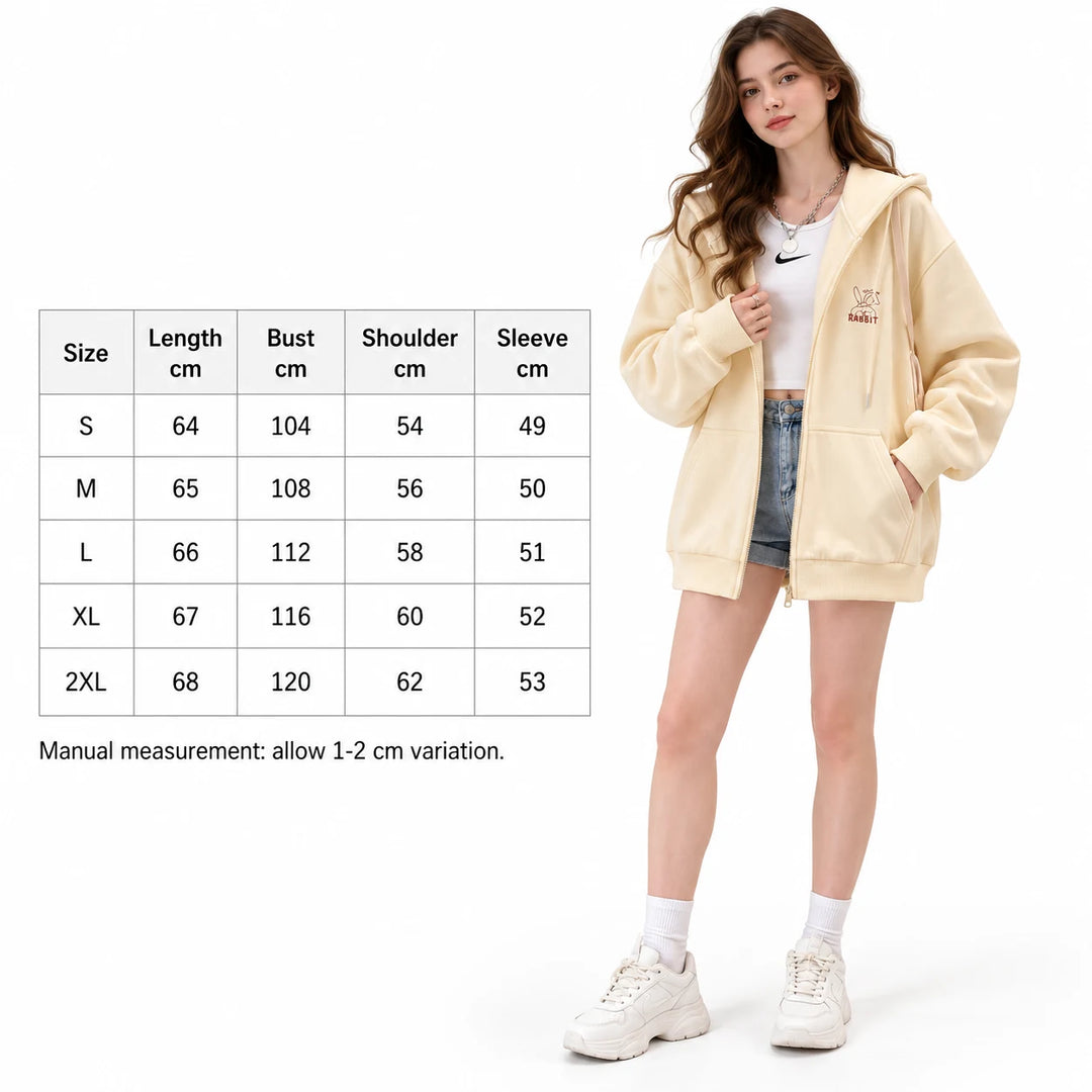English size guide beside a model, listing length, bust, shoulder and sleeve values for S to 2XL, against a white background.