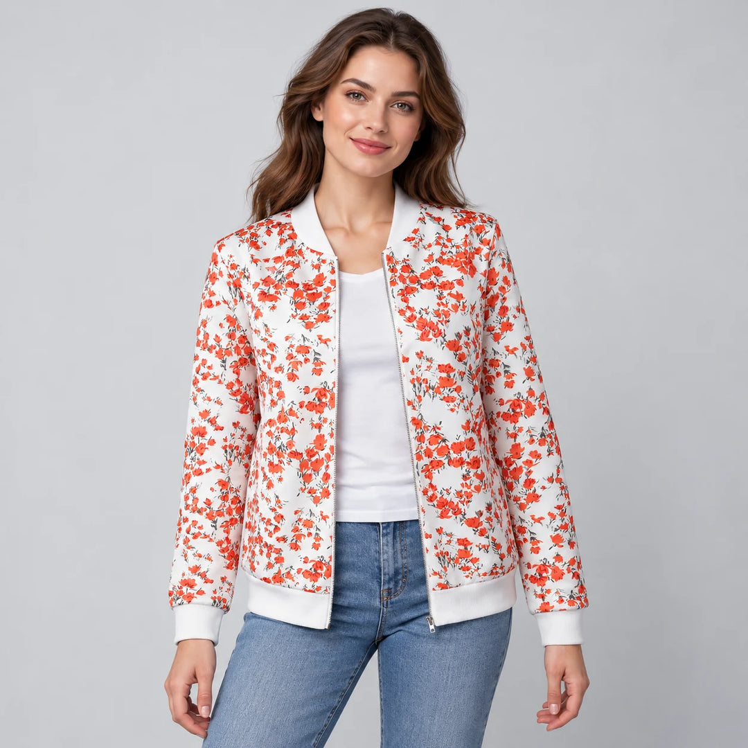 Model wearing the Flower White printed zip-up jacket with a white tee and blue jeans, showing the small blossoms in a studio.