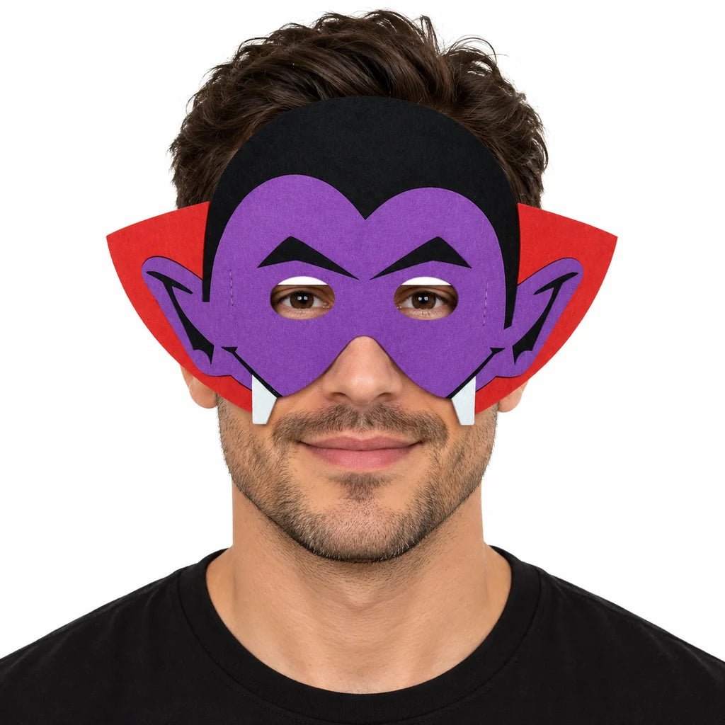 Adult male model wearing a purple vampire felt mask with black hair, red collar and white fang details on a white background.