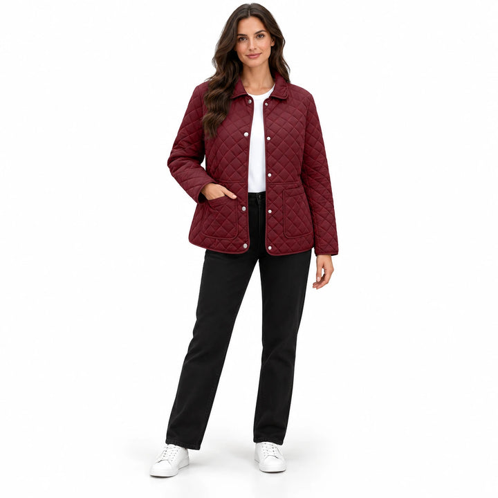 Wine Red quilted jacket on a full-body model wearing black trousers and white sneakers, showing the collar and front pockets.