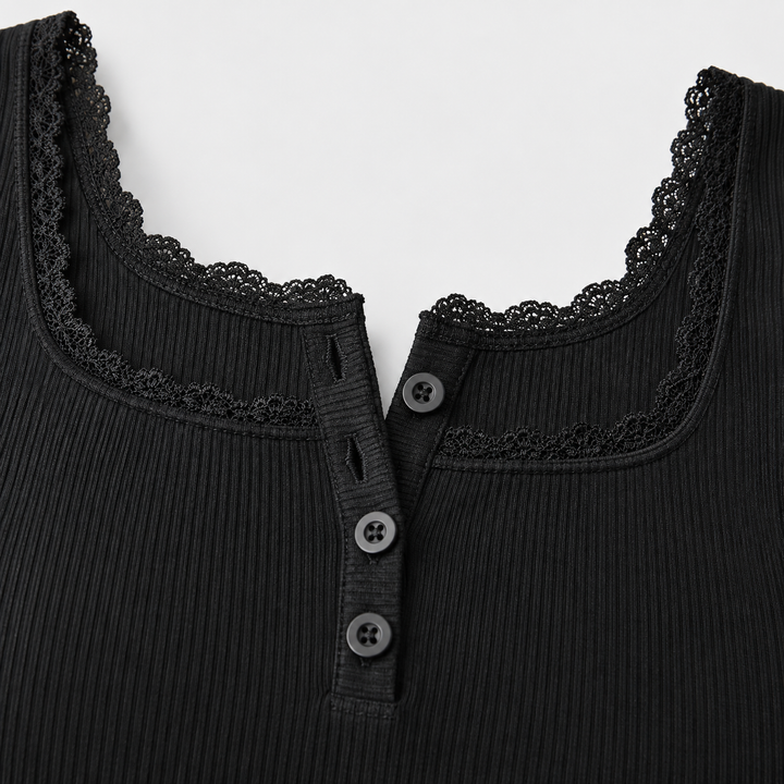 Black lace-edged neckline and three-button placket close-up