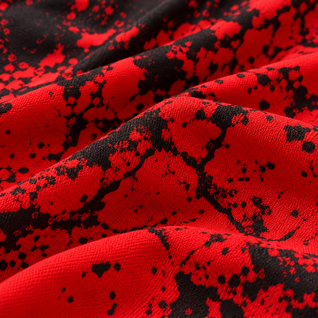 Close-up of Red shorts fabric and black printed detail