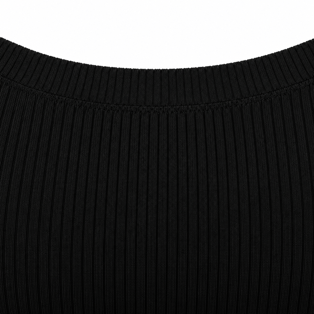 Close-up of the neckline seam and vertical rib texture on the black crop top