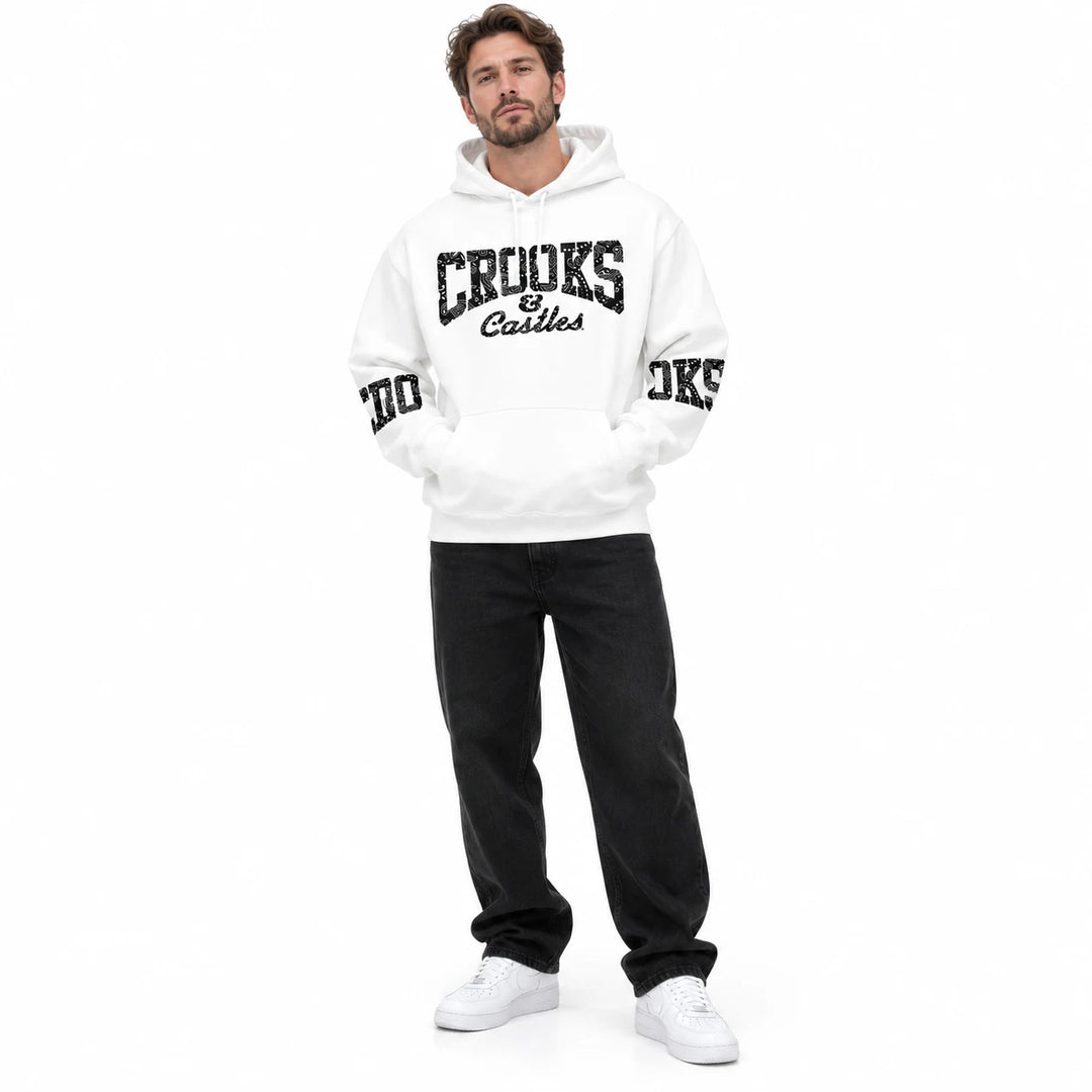 White hoodie with chest and sleeve lettering worn by an adult model, relaxed full-length view on a white background