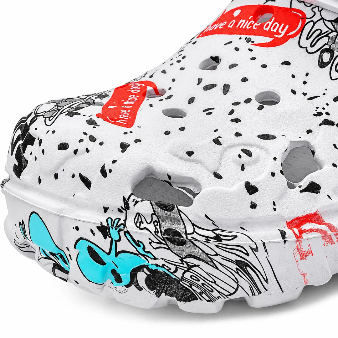 Close-up of graffiti print and perforations on the white molded clog