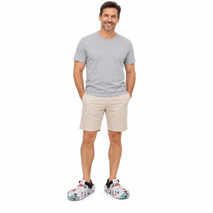 White graffiti platform clogs worn by an adult model, second-model full-length view on a white background