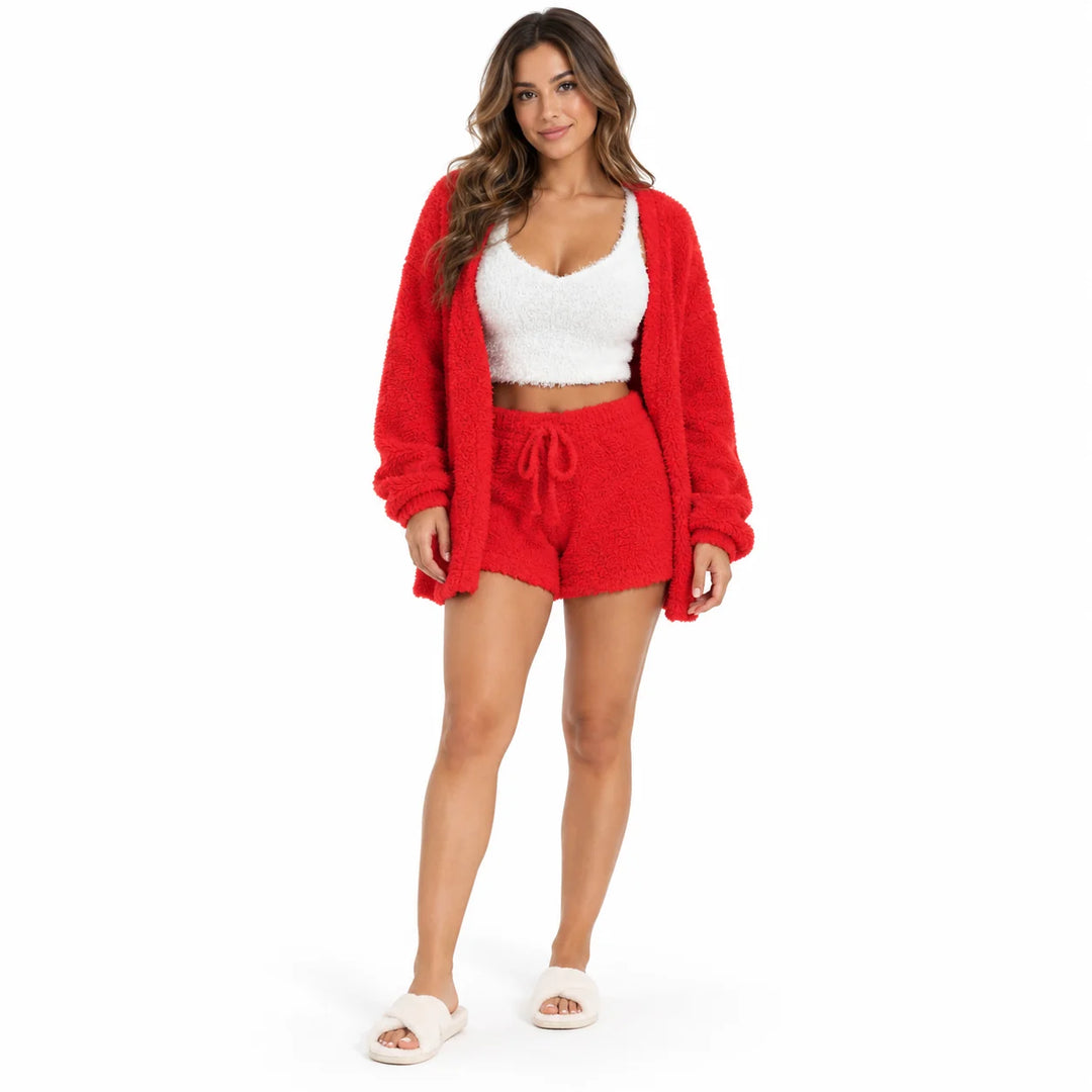 Flannel pajama set in bright red on a studio model, with a white cropped vest, long sleeve coat and drawstring lounge shorts.