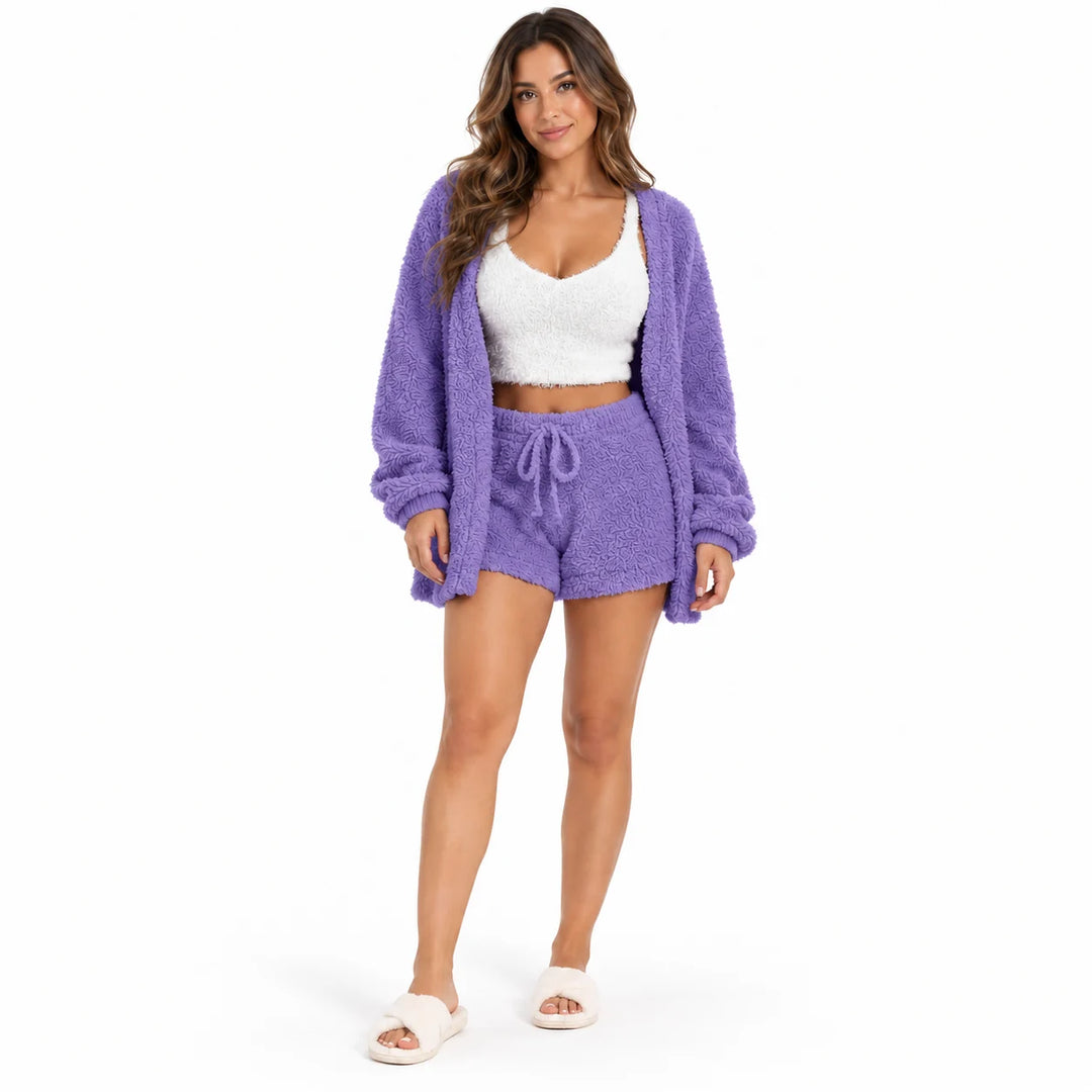 Full-body model wearing a violet coat and drawstring shorts with a white cropped vest, front view on white studio background.