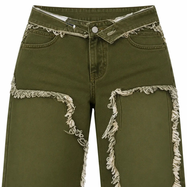 Front waist detail of Olive Green jeans with the outward-folded waistband, fly and upper printed panel outlines against white