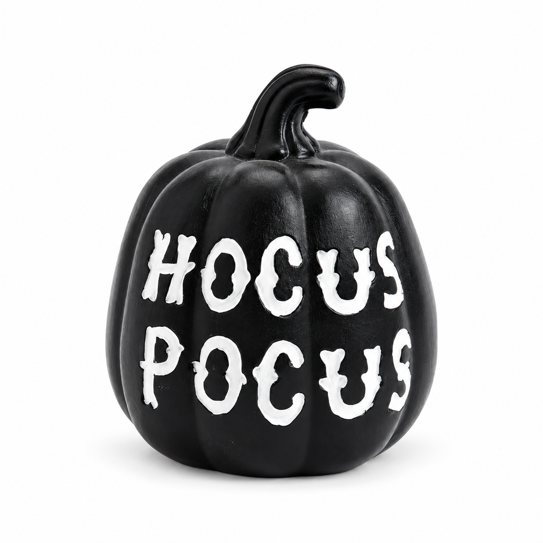 Black resin pumpkin ornament with white HOCUS POCUS lettering and curved stem, shown fully on a pure white studio background.