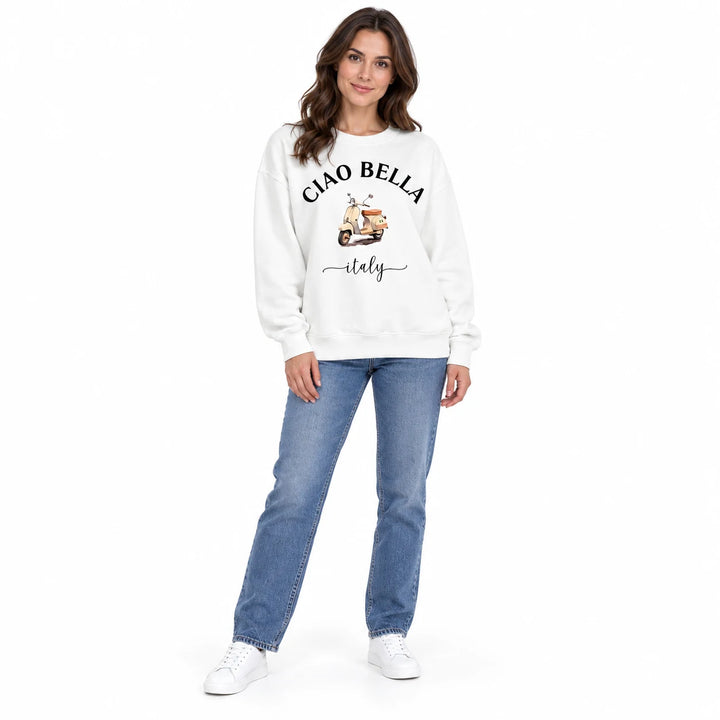 Graphic fleece sweatshirt in white with Ciao Bella lettering and scooter print, worn by a female model in a front studio view