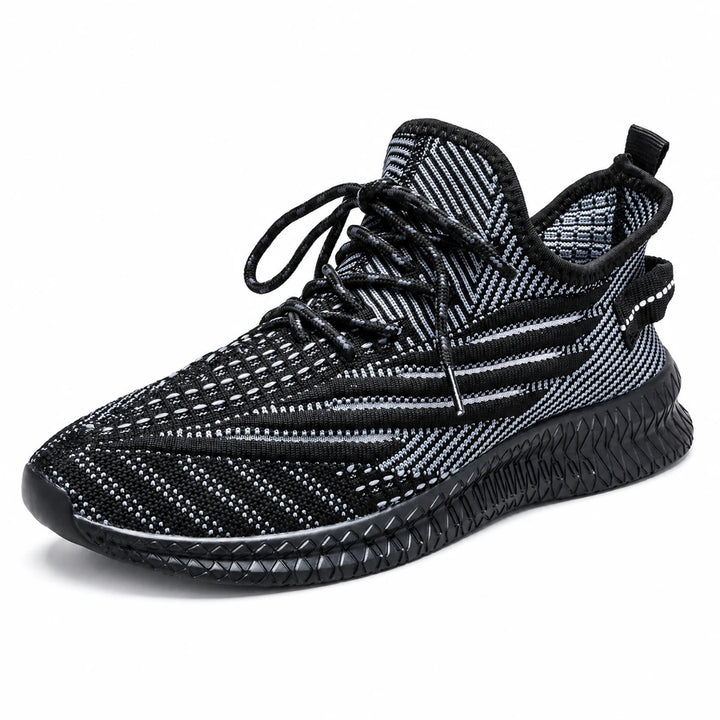 Breathable sneakers for men in black, shown as one complete shoe from a three-quarter angle on a plain white studio backdrop.
