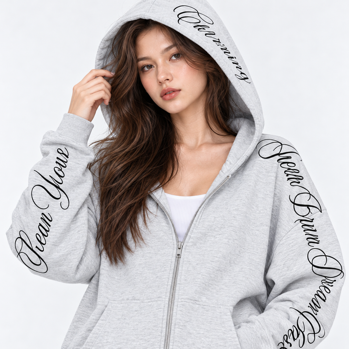 Gray hoodie with decorative script lettering on sleeves and hood