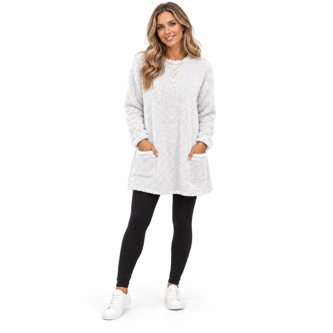 White long fleece pullover worn by an adult woman, showing the round neckline and fleece texture, against a white background.