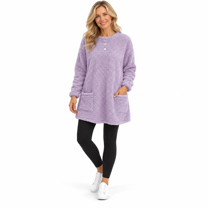 Light Purple long fleece pullover worn by an adult woman, with two patch pockets and long sleeves, in a white studio setting.