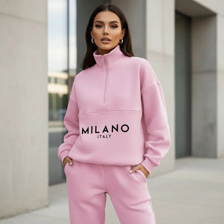 Supplier view of pink half zip sweatshirt and matching jogger set with MILANO ITALY print
