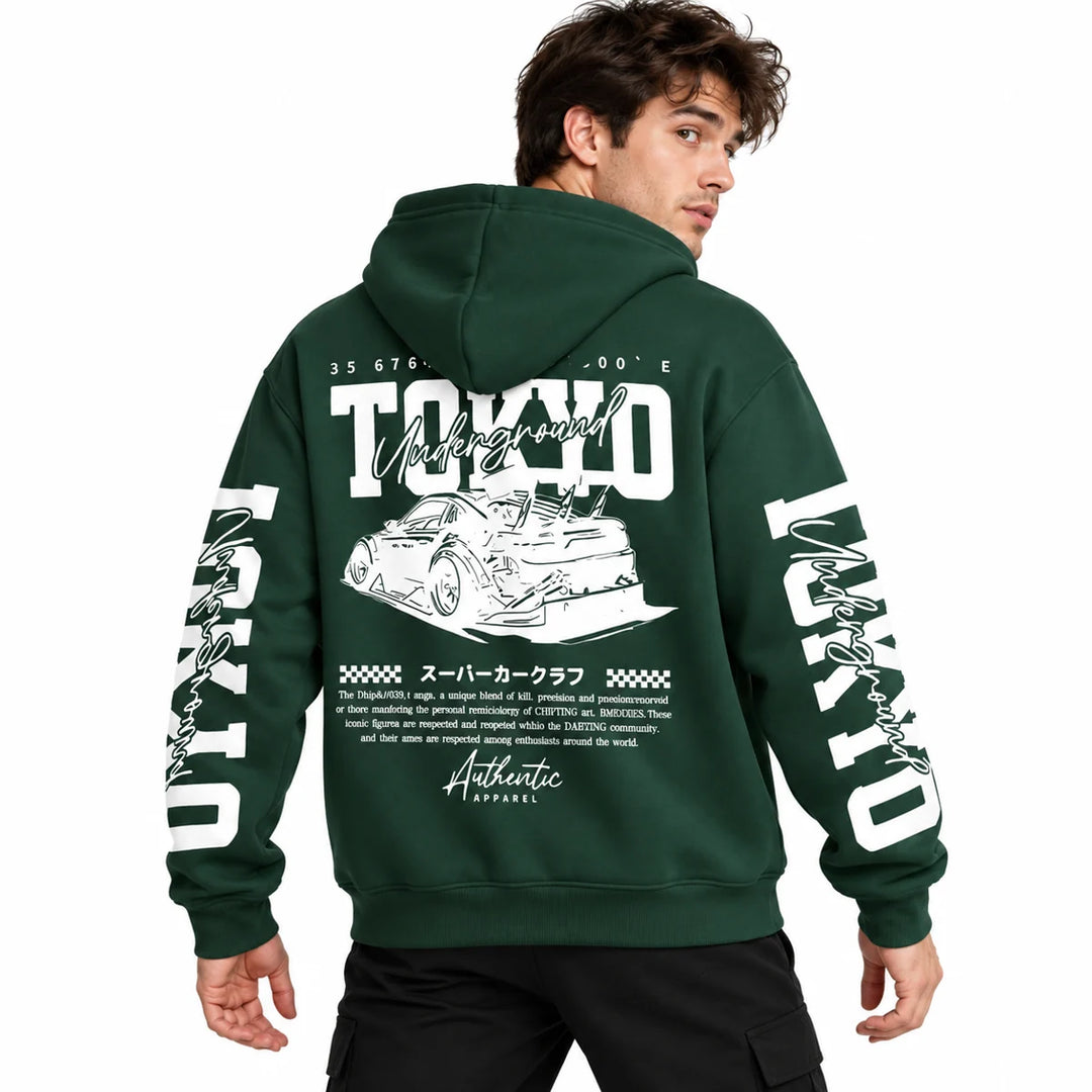 Male model wearing Forest Green Tokyo racing graphic hoodie, showing back artwork and sleeve prints