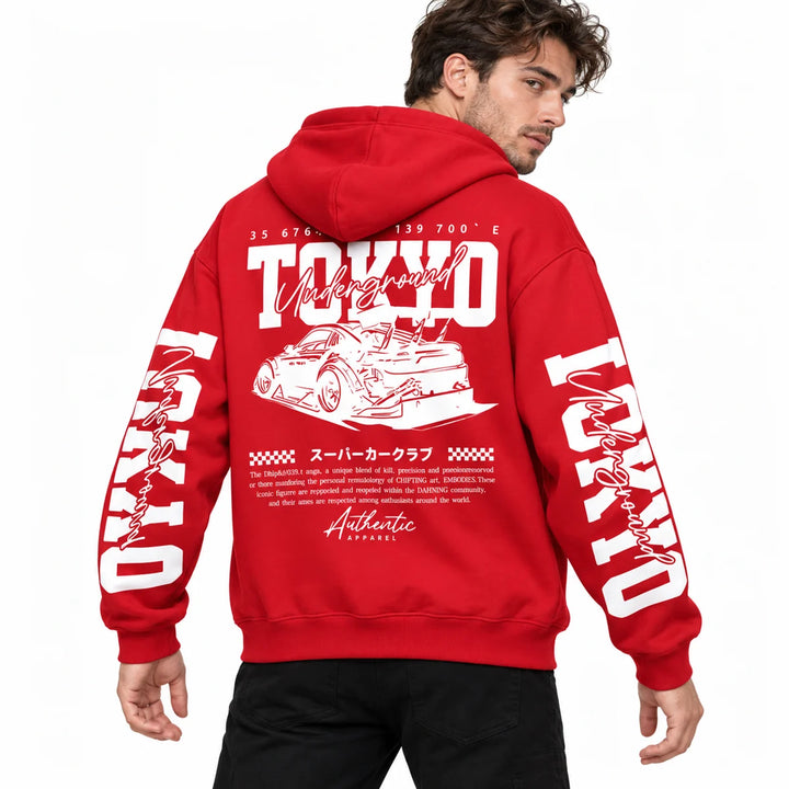 Male model wearing Red Tokyo racing graphic hoodie, showing back artwork and sleeve prints