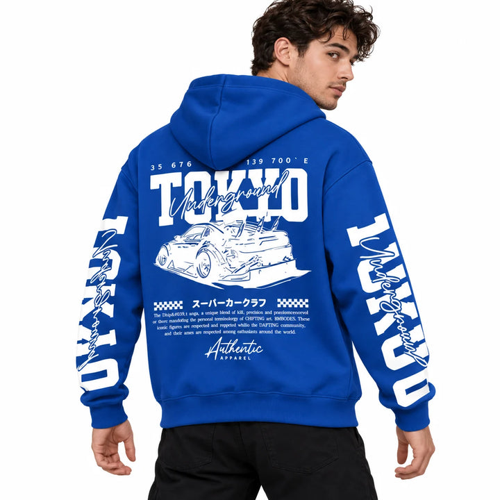 Male model wearing Royal Blue Tokyo racing graphic hoodie, showing back artwork and sleeve prints