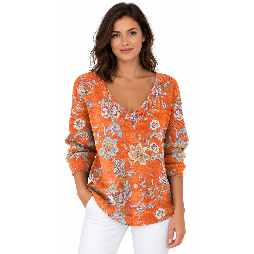 Woman wearing the Orange Floral V-neck long sleeve T-shirt on a white background.