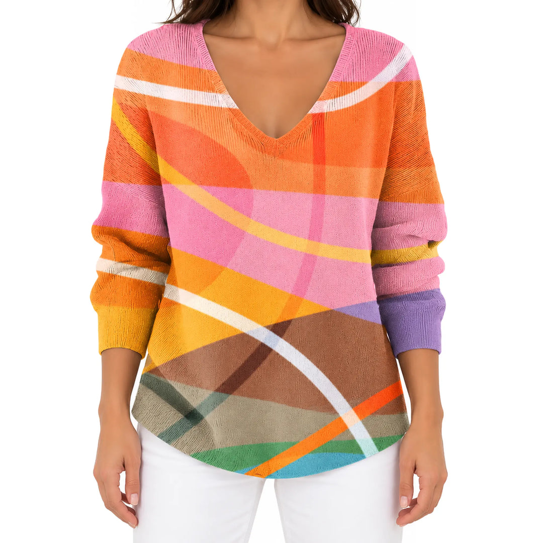 Front view of the Orange and Pink Abstract V-neck long sleeve T-shirt with white trousers.