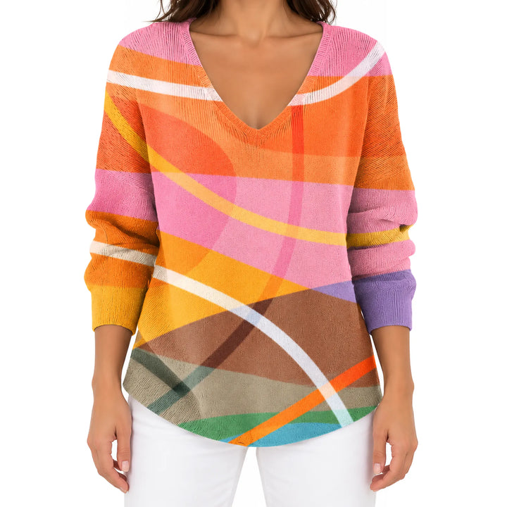 Front view of the Orange and Pink Abstract V-neck long sleeve T-shirt with white trousers.