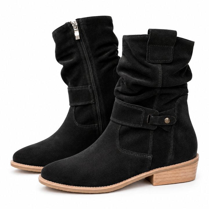 Black gathered-shaft boots with pointed toes, buttoned side tabs and light brown block heels, shown against white background.