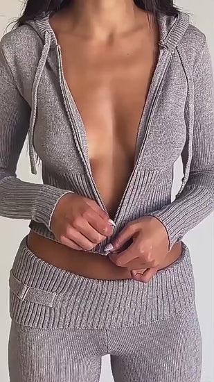 zip up hoodie womens set flat lay blue zip hoodie with hood and matching high waist long pants on neutral backdrop