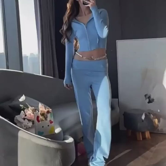 two piece set women blue knit hoodie zip front with splicing detail and coordinated long pants folded for packing