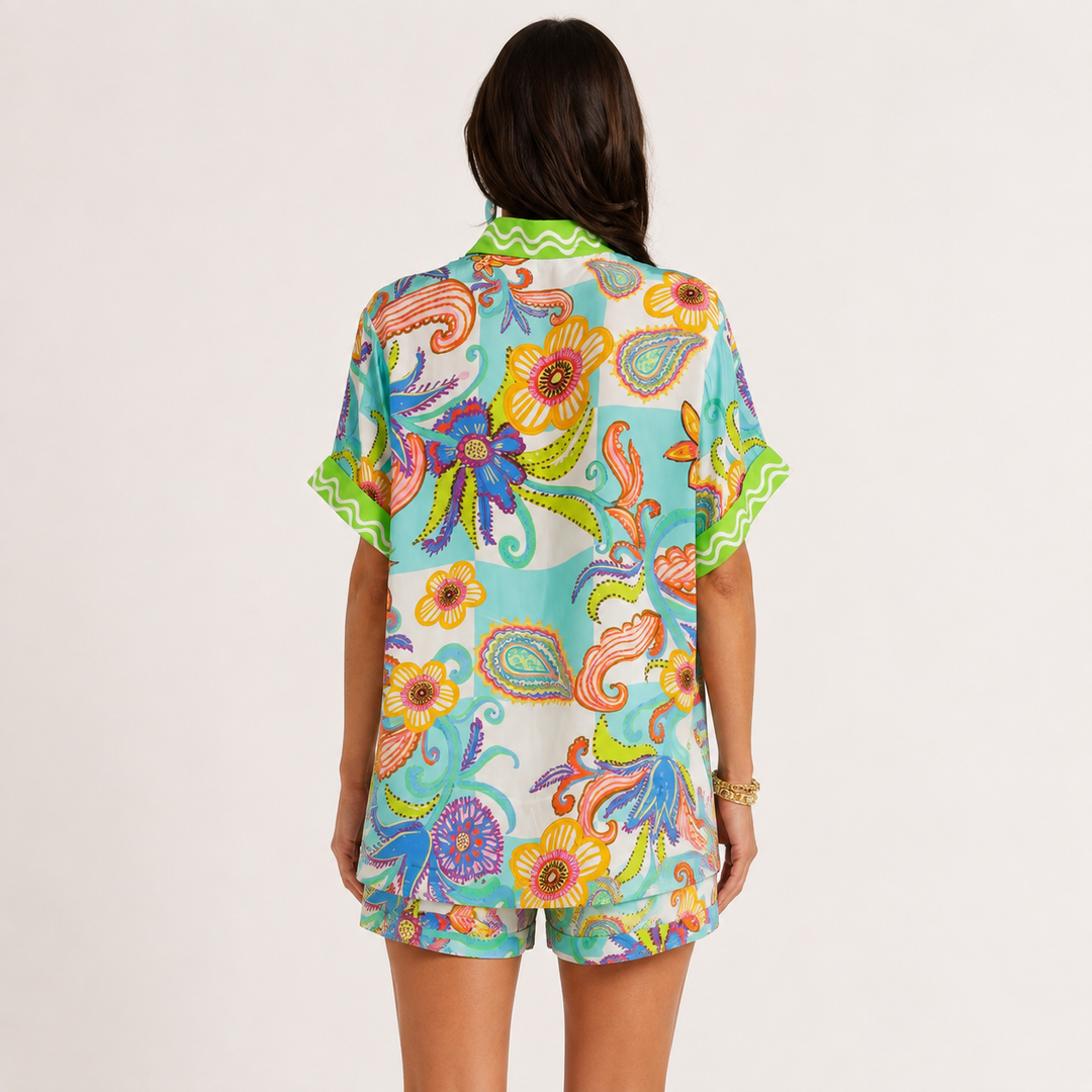 Printed button-down shirt and matching shorts set shown from the back, available in S, M and L, showing the two-piece design.