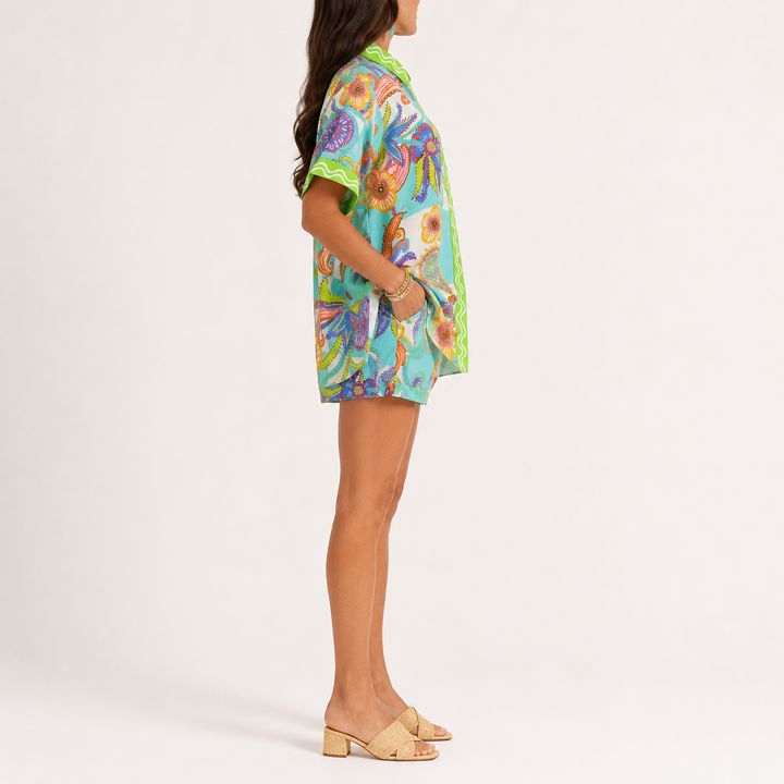 Lime printed button-down shirt and matching shorts set shown from the front, made from 100% polyester, for product reference.