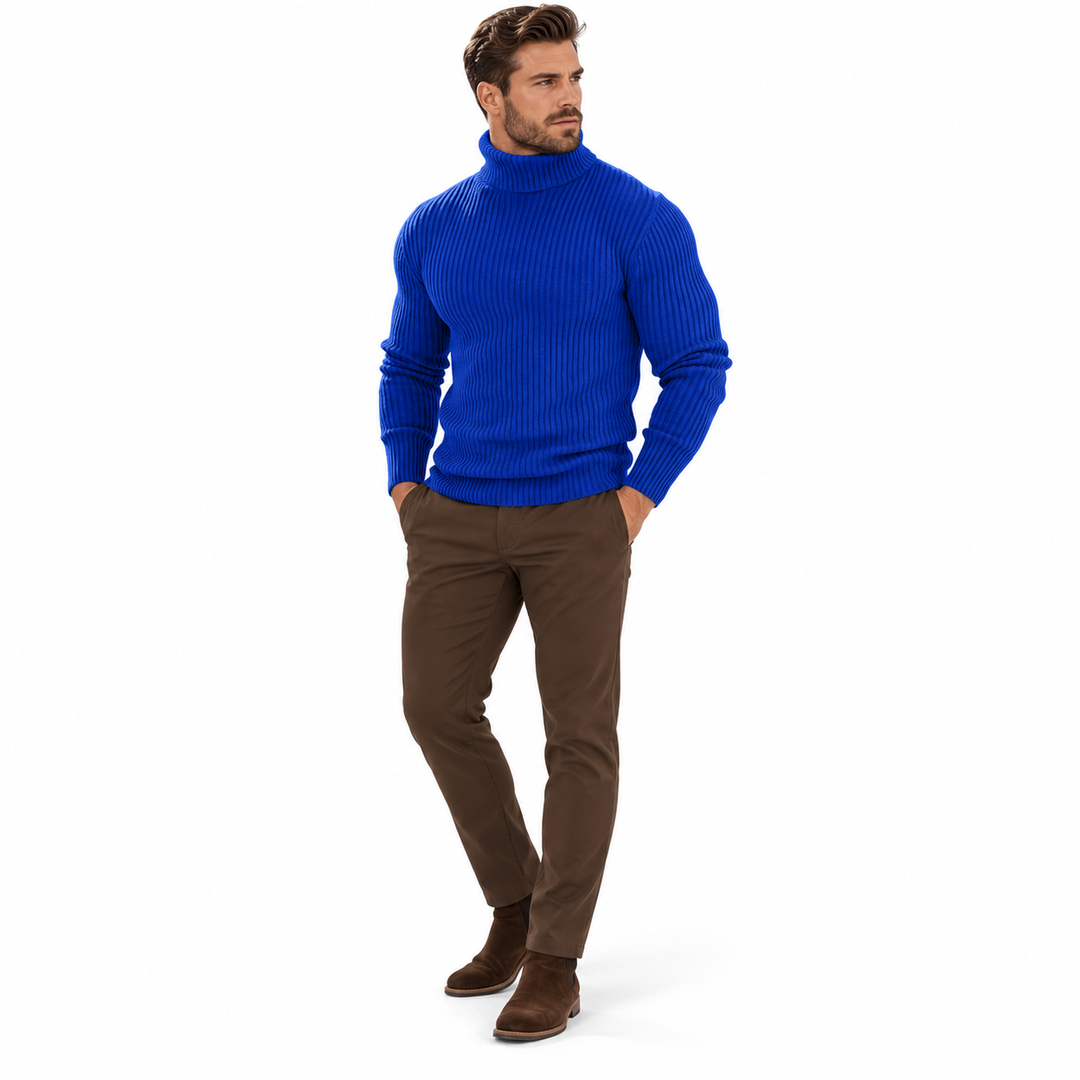 Three-quarter front view of sapphire blue ribbed turtleneck with brown trousers.