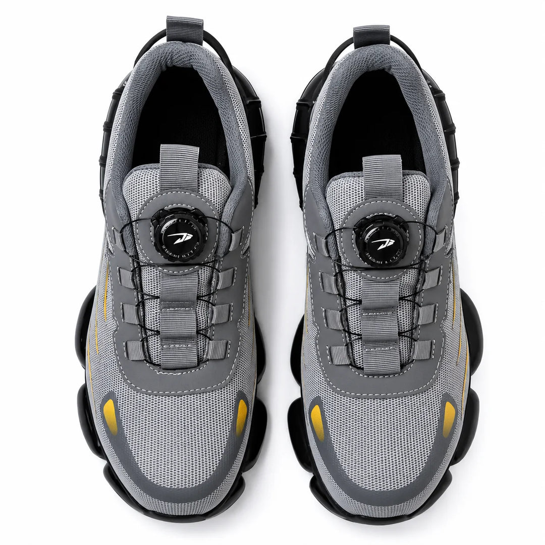 Top view of grey athletic steel toe shoes with dial-style fastening on a white background.