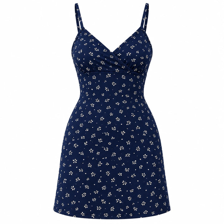 Navy blue mini dress with a small light botanical print, wrap V neckline and thin straps, shown on white.