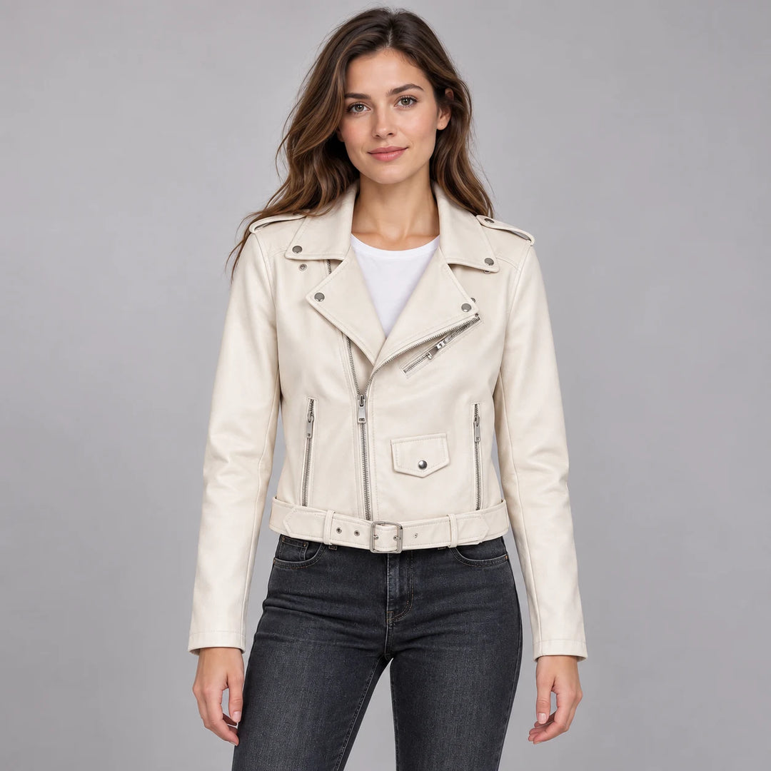 Model wearing the White belted jacket over a white top and dark jeans, with the jacket, lapels, long sleeves and belt visible