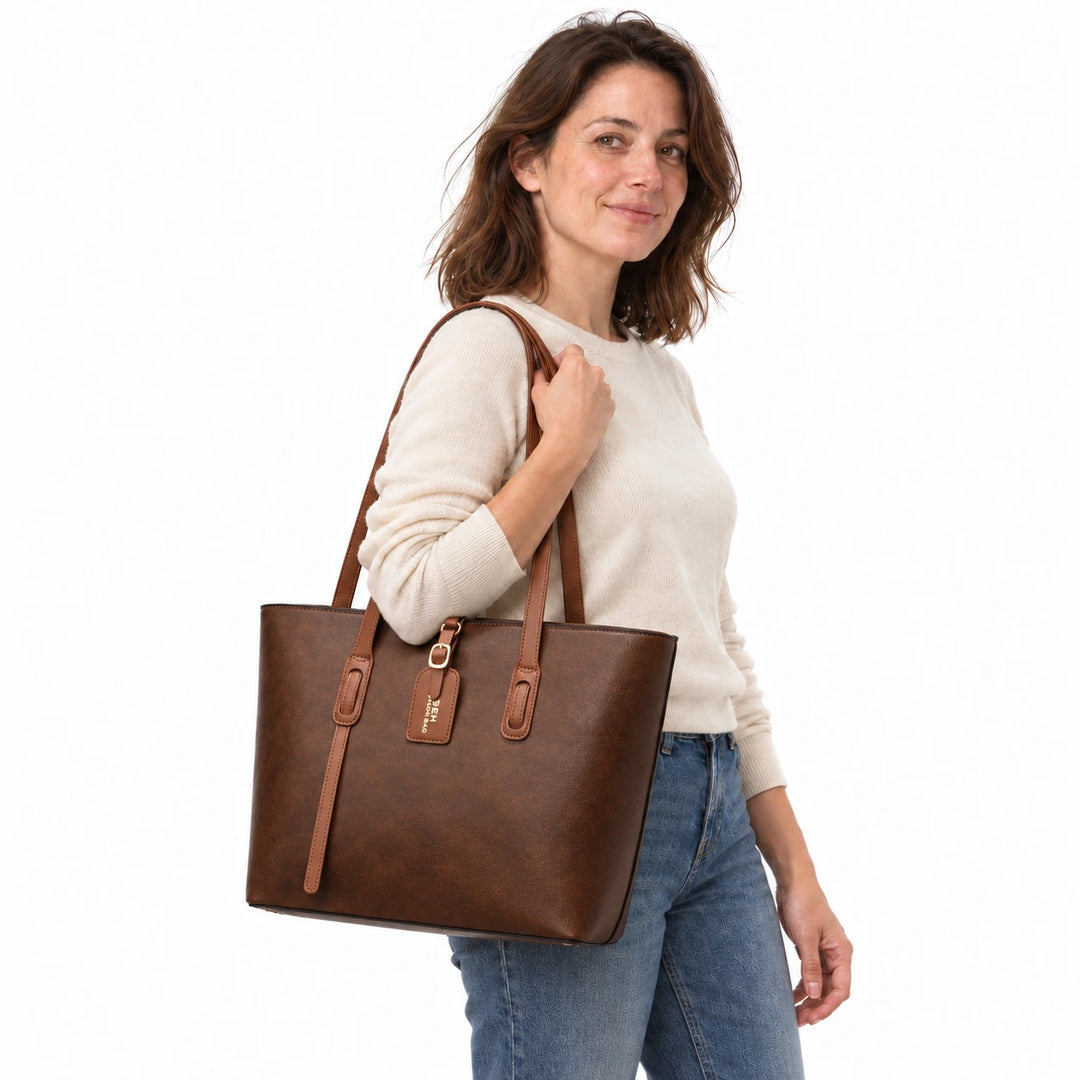 Model carrying the Dark Coffee PU bucket shoulder bag with brown handles