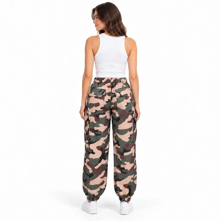 Rear view of an adult model in Army Green Camouflage cargo pants, showing back flap pockets and gathered ankle cuffs on white