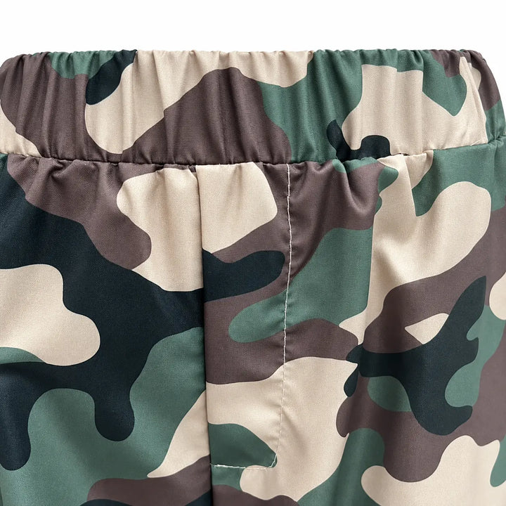Close-up of the elastic waist on Army Green Camouflage cargo pants, showing gathered fabric, a center seam and printed panels